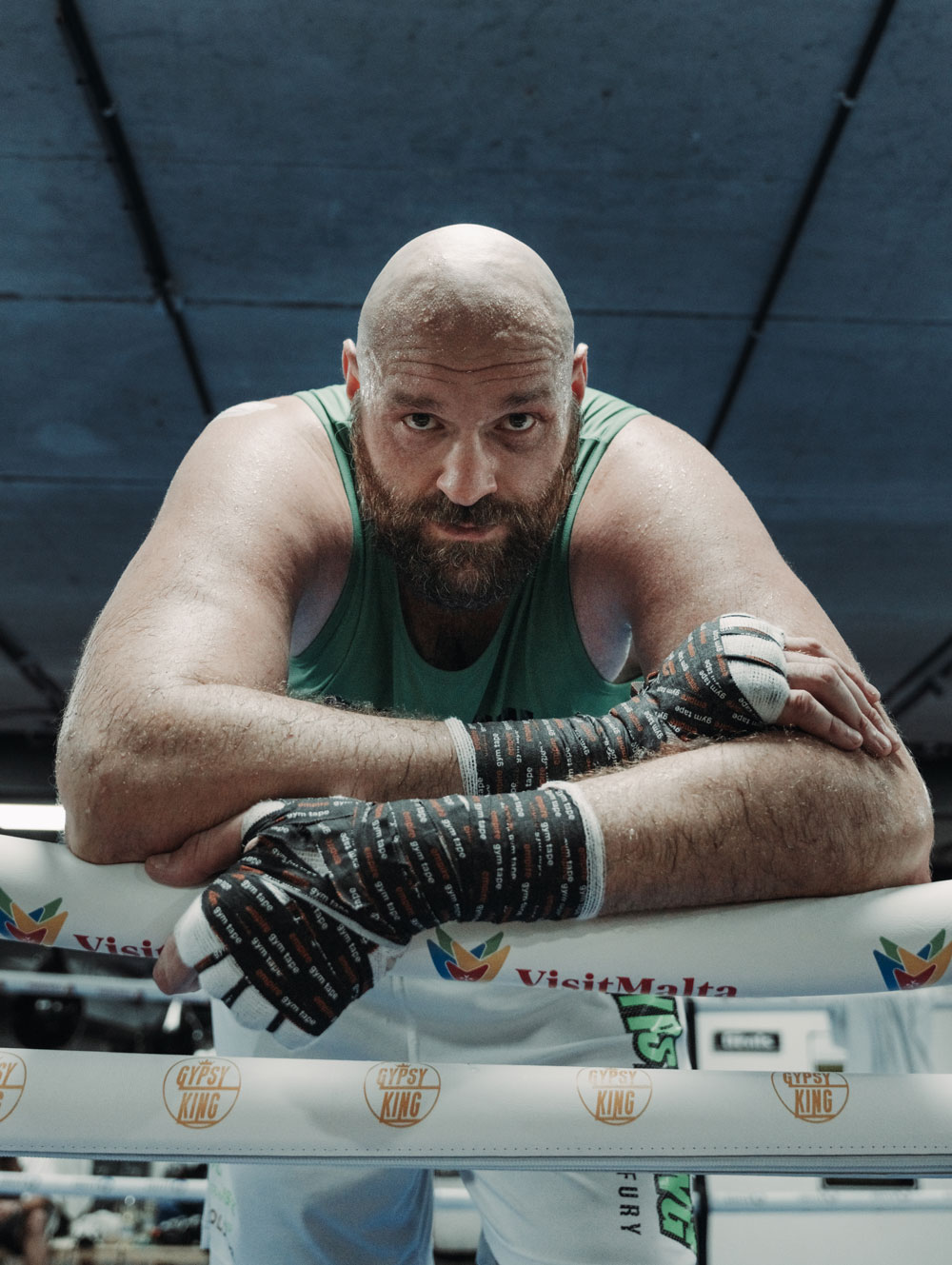 Tyson Fury leaning over boxing ring ropes